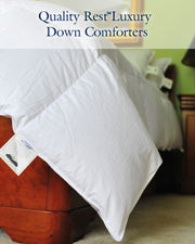 Down comforter draped over bed